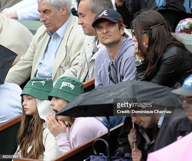 David Hallyday and his Family watch the action during the Men's Singles Final match Robin Soderling of Sweden and Roger Federer of Switzerland on day...