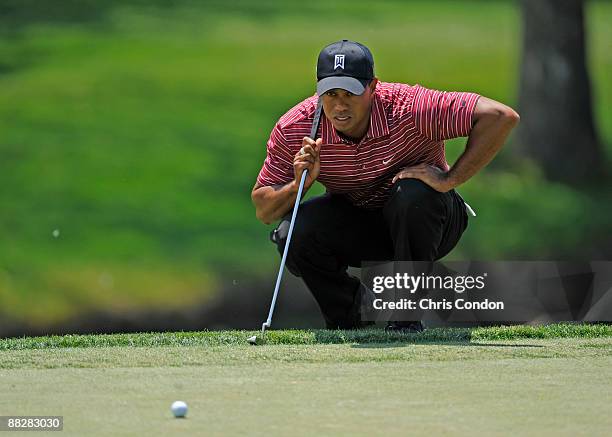 Tiger Woods lines up a birdie putt on during the final round of the Memorial Tournament at Muirfield Village Golf Club on June 7, 2009 in Dublin,...