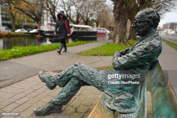 Patrick Kavanagh statue along the Grand Canal in Dublin on the day of the 50th Anniversary of his death. Kavanagh was an Irish poet and novelist. His...