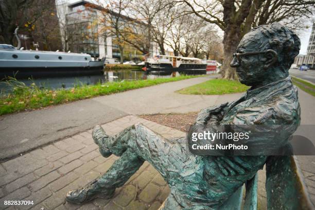 Patrick Kavanagh statue along the Grand Canal in Dublin on the day of the 50th Anniversary of his death. Kavanagh was an Irish poet and novelist. His...