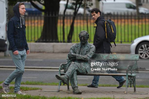 Patrick Kavanagh statue along the Grand Canal in Dublin on the day of the 50th Anniversary of his death. Kavanagh was an Irish poet and novelist. His...