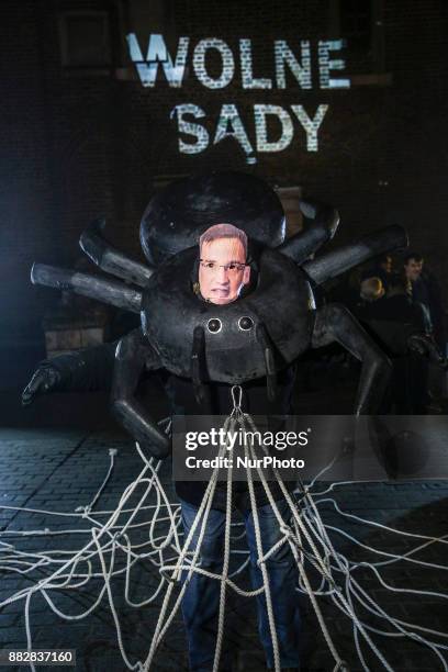 Man dressed as spider with a mask of of Zbigniew Ziobro, Minister of Justice, takes part in a protest at the Main Square against government plans for...