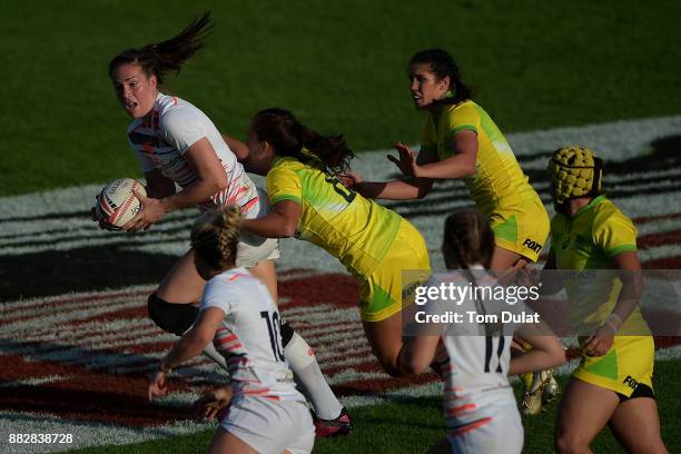 Emily Scarratt of England in action during the match between Australia and England on Day One of the Emirates Dubai Rugby Sevens - HSBC Sevens World...