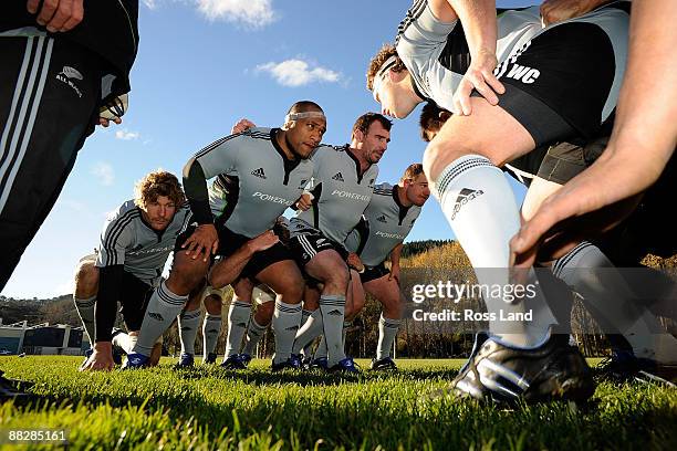 Adam Thomson, Neemia Tialata, Andrew Hore and Tony Woodcock pack down in the scrum during a New Zealand All Blacks training session at University...
