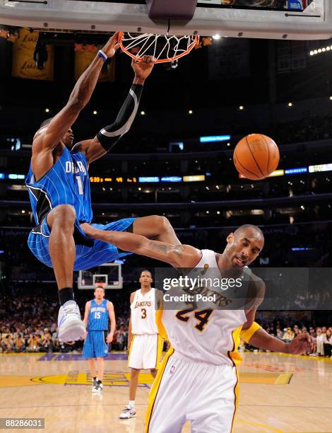 Dwight Howard of the Orlando Magic dunks the ball over Kobe Bryant of the Los Angeles Lakers in Game Two of the 2009 NBA Finals at Staples Center on...