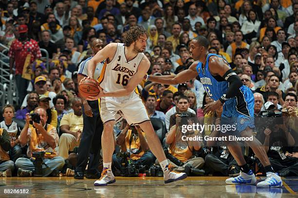 Pau Gasol of the Los Angeles Lakers drives against Dwight Howard of the Orlando Magic during Game Two of the 2009 NBA Finals at Staples Center on...