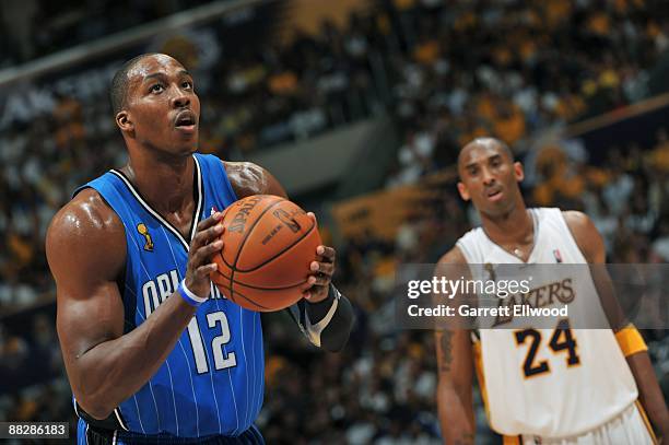 Dwight Howard of the Orlando Magic shoots against Kobe Bryant of the Los Angeles Lakers during Game Two of the 2009 NBA Finals at Staples Center on...