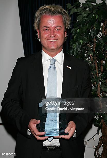 Dutch politician and Party for Freedom chairman Geert Wilders poses with his Hero of Conscience Award at the American Freedom Alliance's Heroes of...