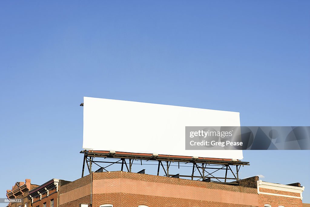 Blank Billboard Sign on Building Rooftop