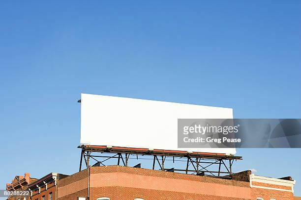 blank billboard sign on building rooftop - baltimore maryland stock pictures, royalty-free photos & images