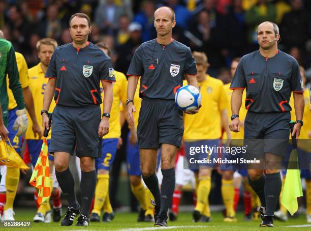 Referee Mike Riley with assistant referees Darren Conn and Richard West of England during the FIFA2010 World Cup Qualifying Group 1 match between...