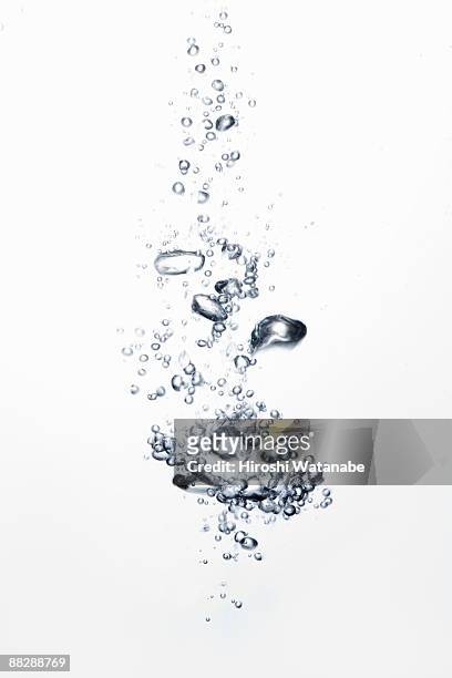 bubbles rising through water - bubble stock pictures, royalty-free photos & images
