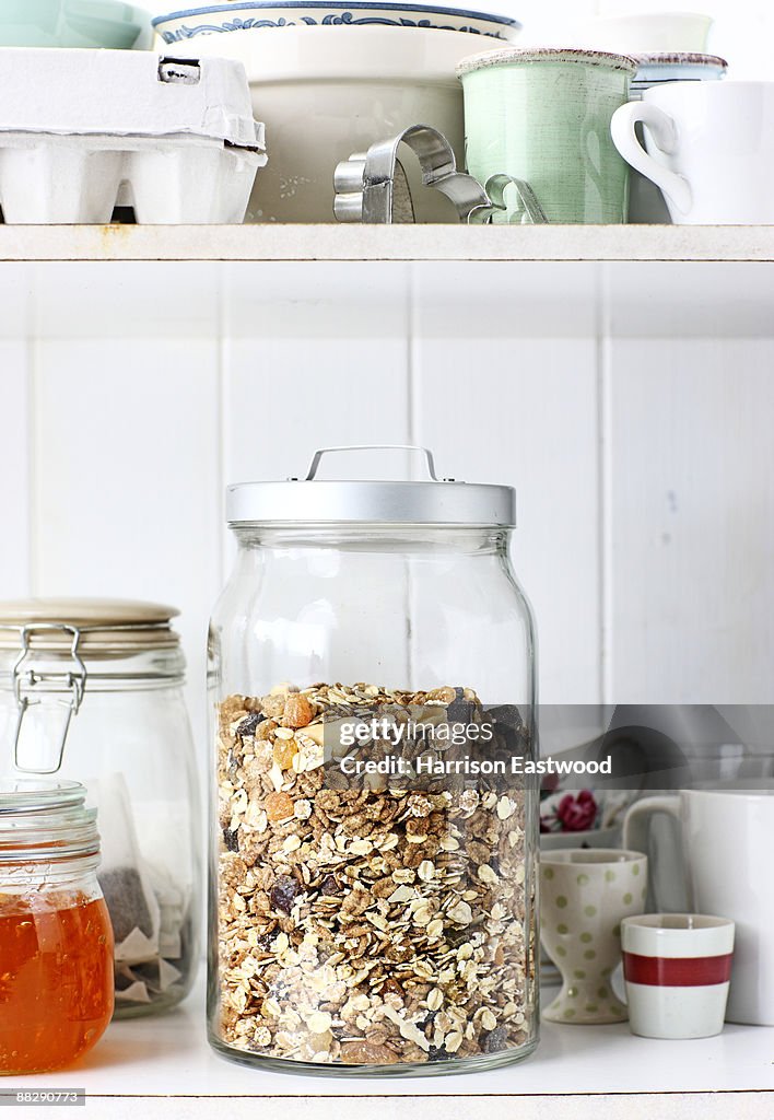 Jar of museli in kitchen cupboard