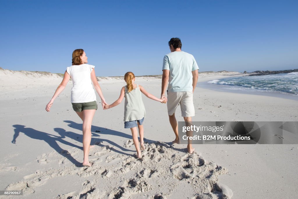 Family walking on a beach