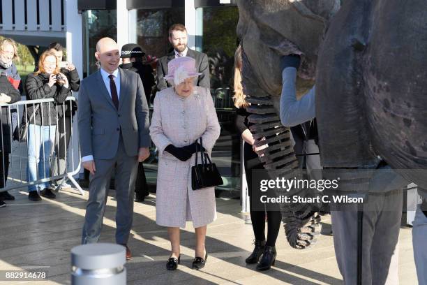 Queen Elizabeth II looks on performers at the Chichester Theatre while visiting West Sussex on November 30, 2017 in Chichester, United Kingdom.