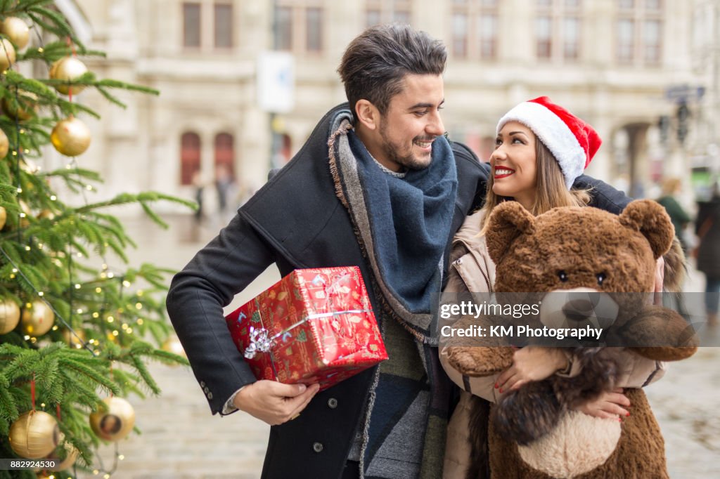Happy couple shopping for christmas