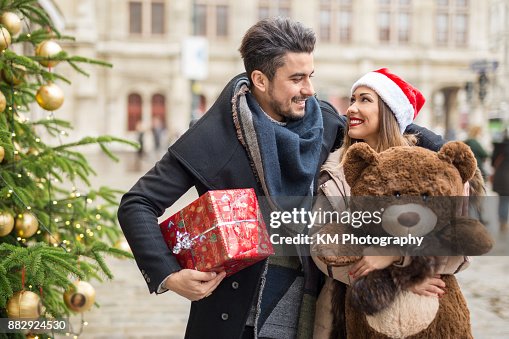 Happy couple shopping for christmas Happy couple shopping for christmas
