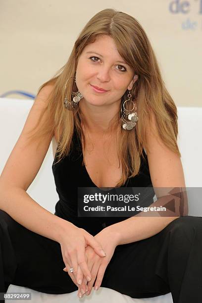 French actress Aurore Pourteyron poses at a photocall for the TV series 'Hero Corp' during the 2009 Monte Carlo Television Festival held at Grimaldi...