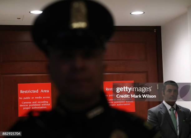 Capitol Police stand guard outside of a closed door session of the House Intelligence Committee where they are hearing testimony from U.S. Attorney...