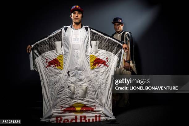 French wingsuit jumpers Fred Fugen and Vince Reffet , also known as the 'Soul Flyers', pose during a photo session on November 28, 2017 in Paris. -...