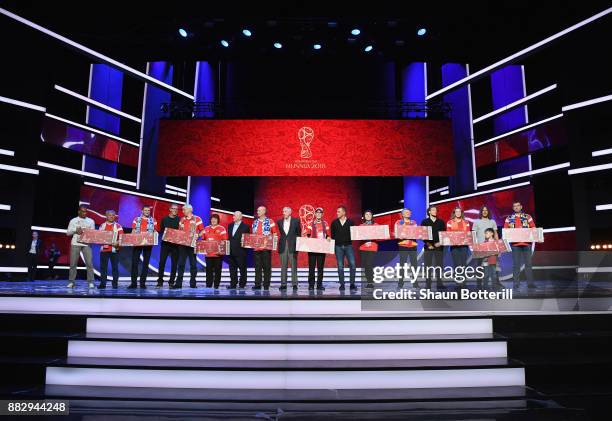 Cafu, Laurent Blanc, Nikita Simonyan, Gordon Banks, Fabio Cannavaro, Diego Forlan and Carlos Puyol pose with the Super Fans from the host cities...