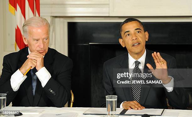 President Barack Obama remarks as Vice President Joe Biden looks on during a meeting with his Cabinet to discuss the implementation of the Recovery...
