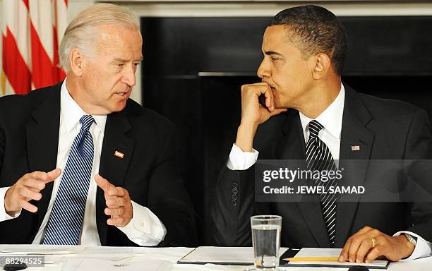 President Barack Obama listens as Vice President Joe Biden makes remarks during a meeting with his Cabinet to discuss the implementation of the...