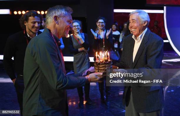 Conductor Gary Lineker receives a birthday cake by Gordon Banks prior to the 2018 FIFA World Cup Draw the 2018 FIFA World Cup Draw at the Draw hall...
