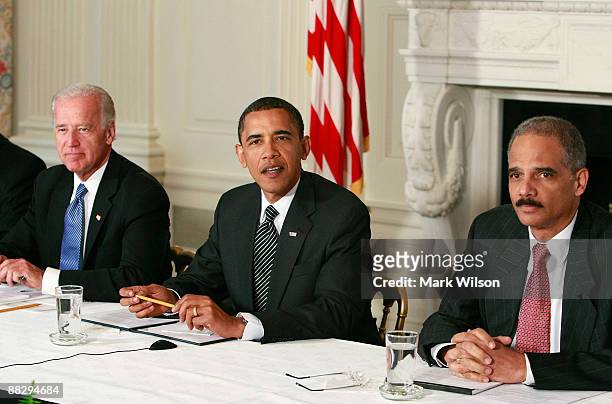 President Barack Obama speaks while Attorney General Eric Holder and Vice President Joseph Biden listen during a Cabinet meeting at the White House...