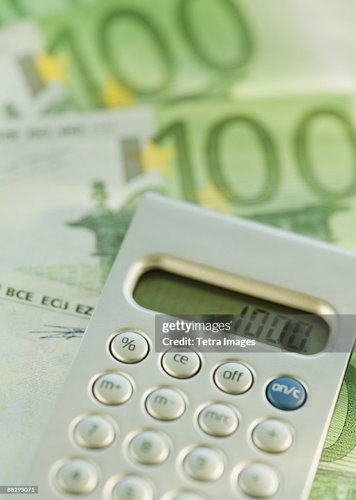 Calculator and 100 euro notes