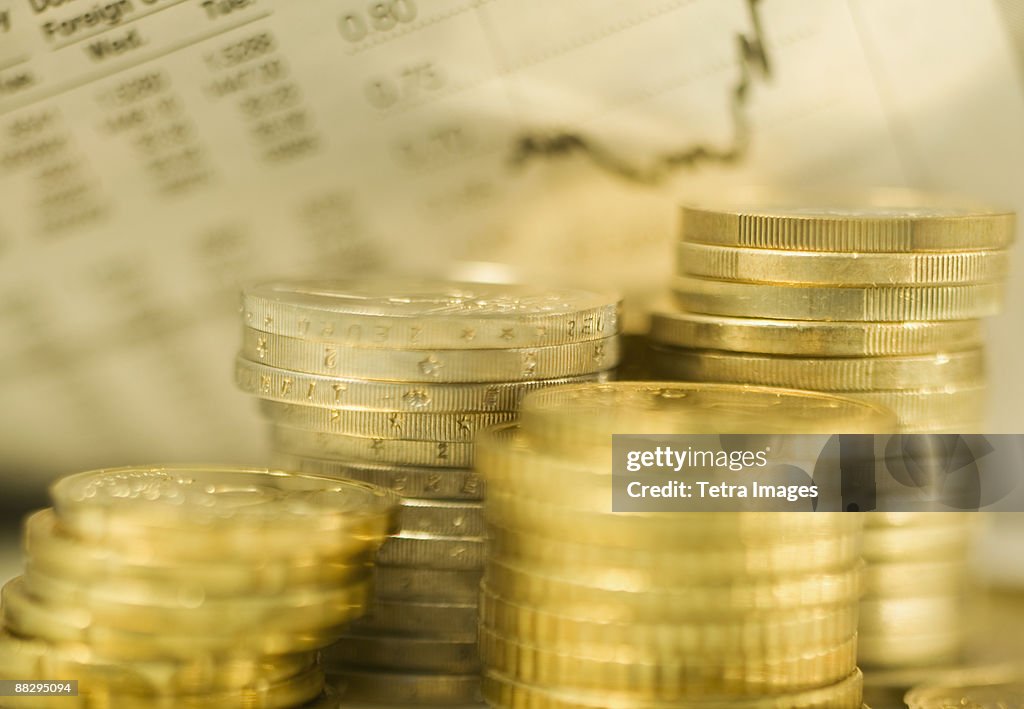 Stacks of euro coins and exchange rates