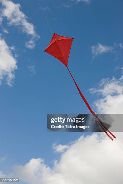 red kite in sky - kite gliding stock pictures, royalty-free photos & images