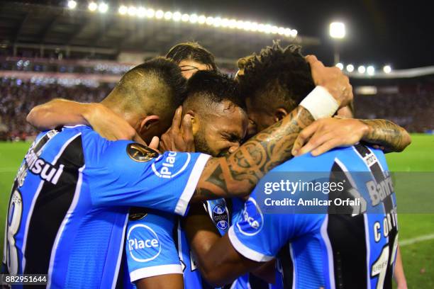 Fernandinho of Gremio and teammates celebrate the opening goal during the second leg match between Lanus and Gremio as part of Copa Bridgestone...