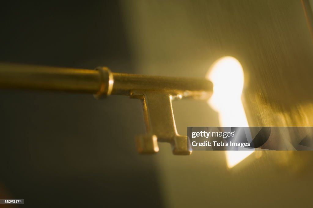 Close Up Of Keyhole And Key Photo - Getty Images