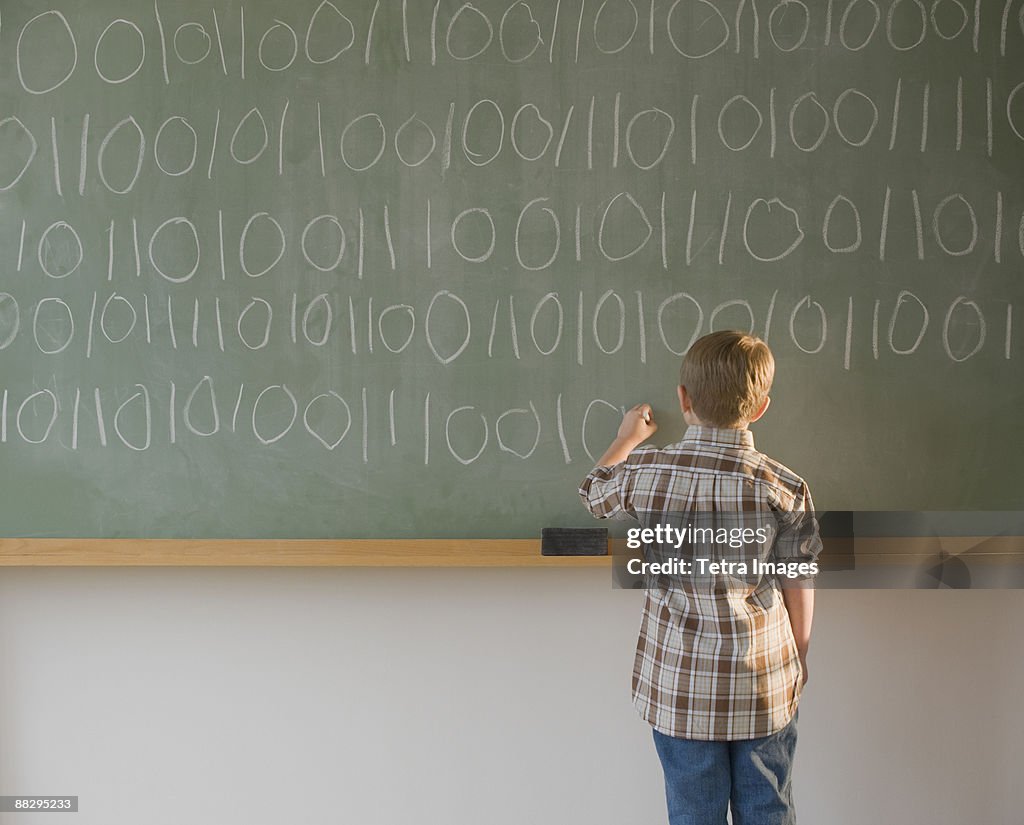 Kid Write Code Boy Writing Binary Code On Blackboard High-Res Stock Photo - Getty Images
