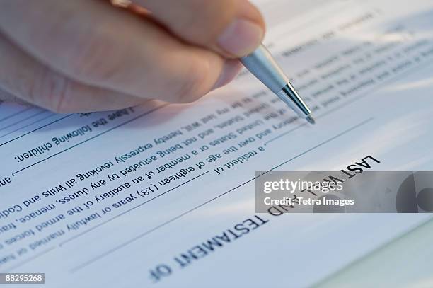 man signing will - writing a will stock pictures, royalty-free photos & images