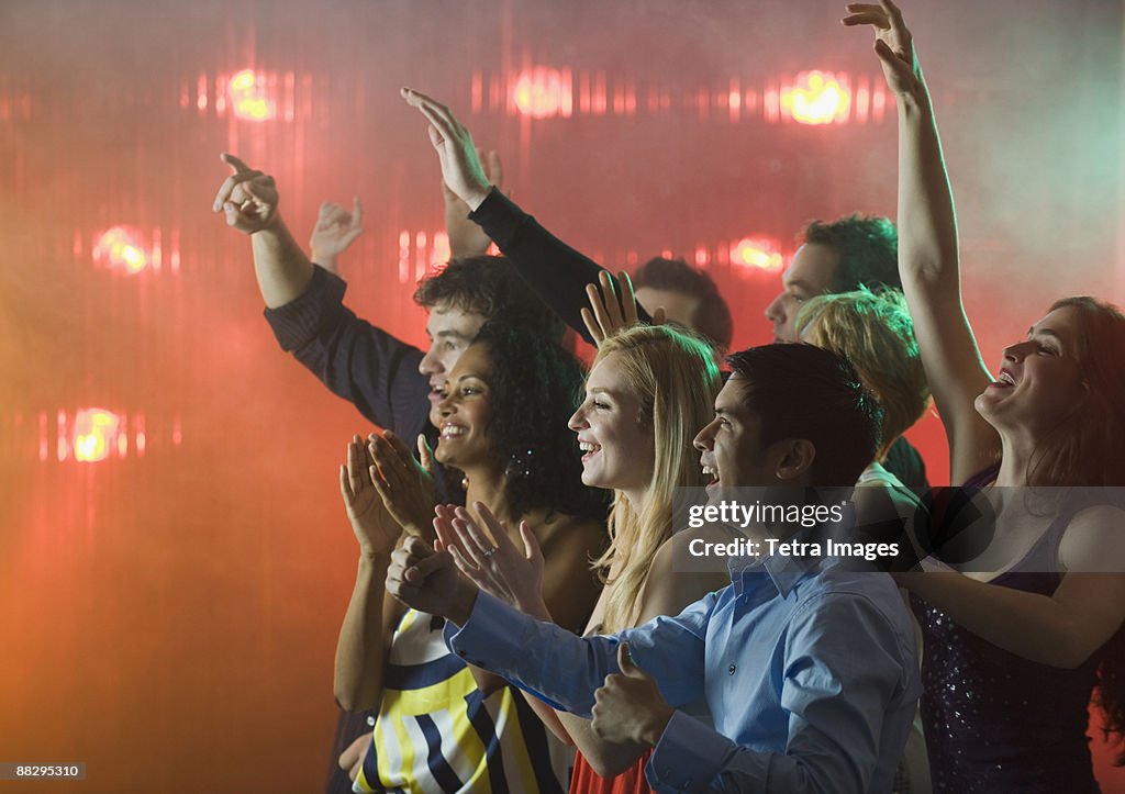 People enjoying concert