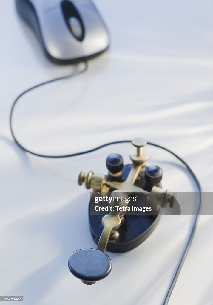 Antique telegraph key and computer mouse