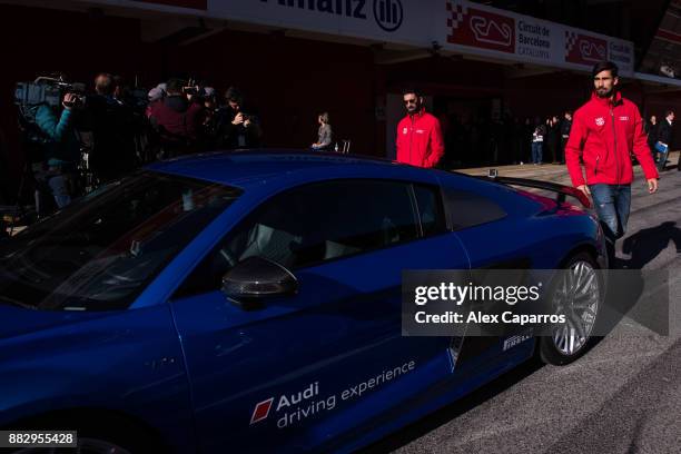 Arda Turan and Andre Gomes of FC Barcelona prepare to enjoy the Audi Driving Experience during the Audi Car handover to the players of FC Barcelona...