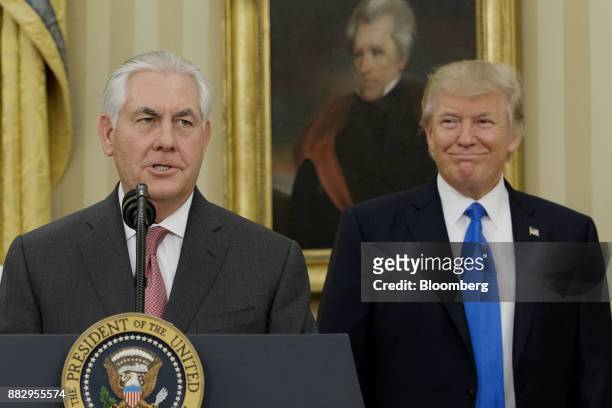 Rex Tillerson, U.S. Secretary of State, left, speaks as U.S. President Donald Trump listen after the swearing-in ceremony in the Oval Office of the...