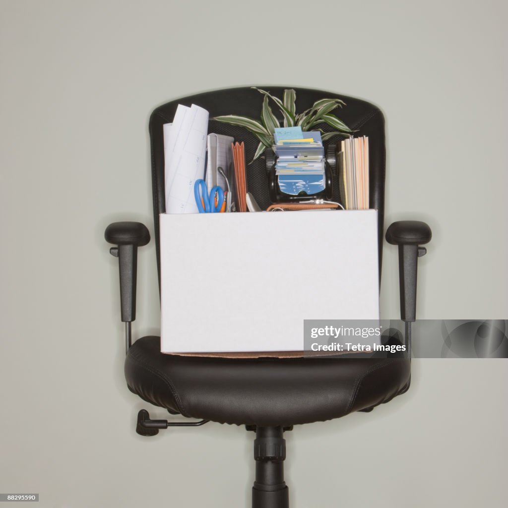 Packed box on office chair