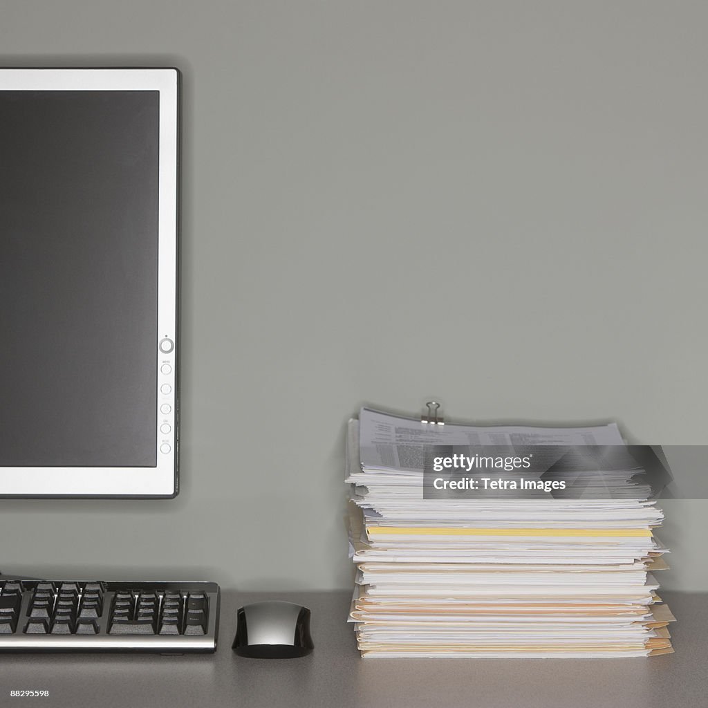 Paper Work Computer Screen Computer And Stack Of Paperwork High-Res Stock Photo - Getty Images