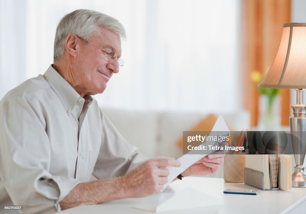 Senior man reading letter
