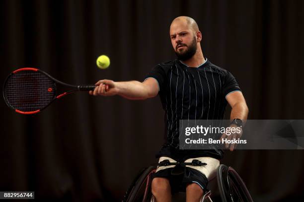 Stefan Olsson of Sweden in action during his match against Stephane Houdet of France on day 2 of The NEC Wheelchair Tennis Masters at Loughborough...