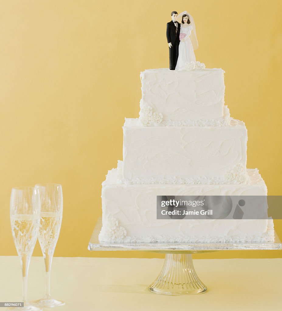Wedding cake toppers on cake