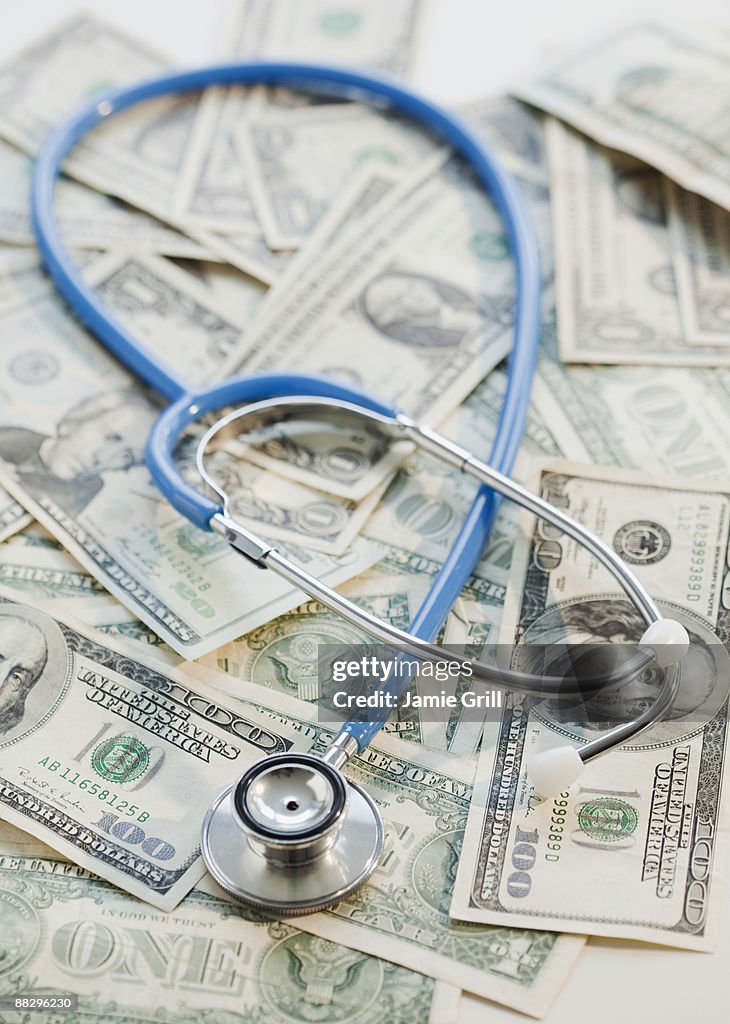 Stethoscope on pile of money
