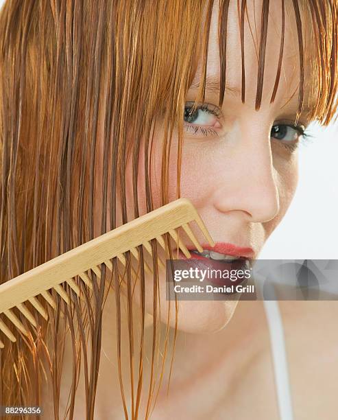 woman combing hair - combing stock pictures, royalty-free photos & images