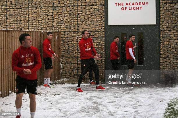 John O'Shea and first team players come under snowball attack from Academy players showing the bad weather that forced an indoor training session at...