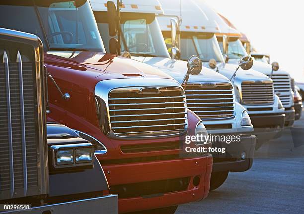 semi-trucks in a row - fleet of vehicles stock pictures, royalty-free photos & images