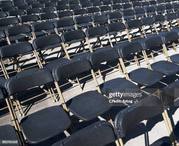 empty stadium seats - folding chair stock pictures, royalty-free photos & images